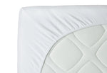 Close-up of a white mattress cover with quilted texture on a white background